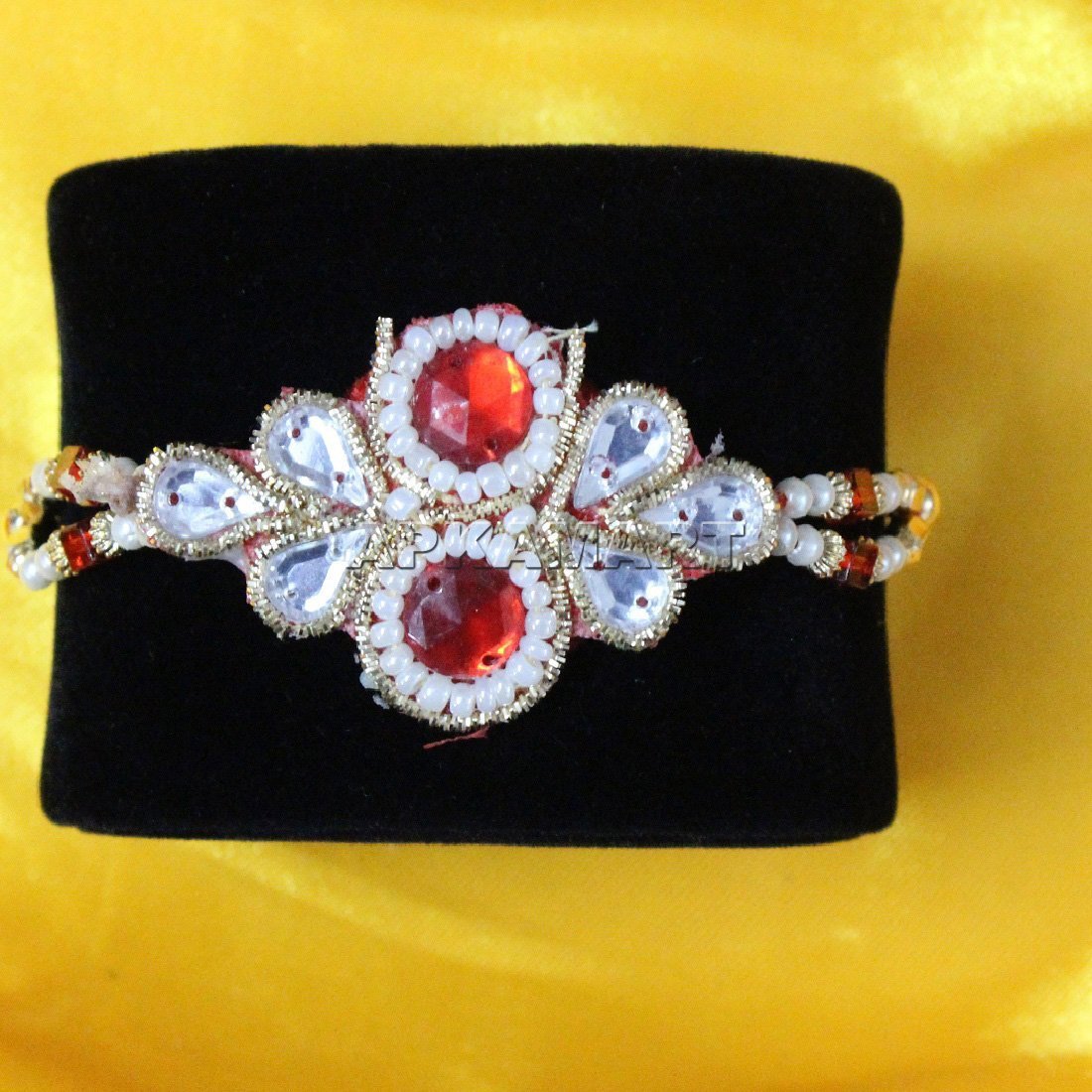 Orange and White Bead Rakhi - ApkaMart