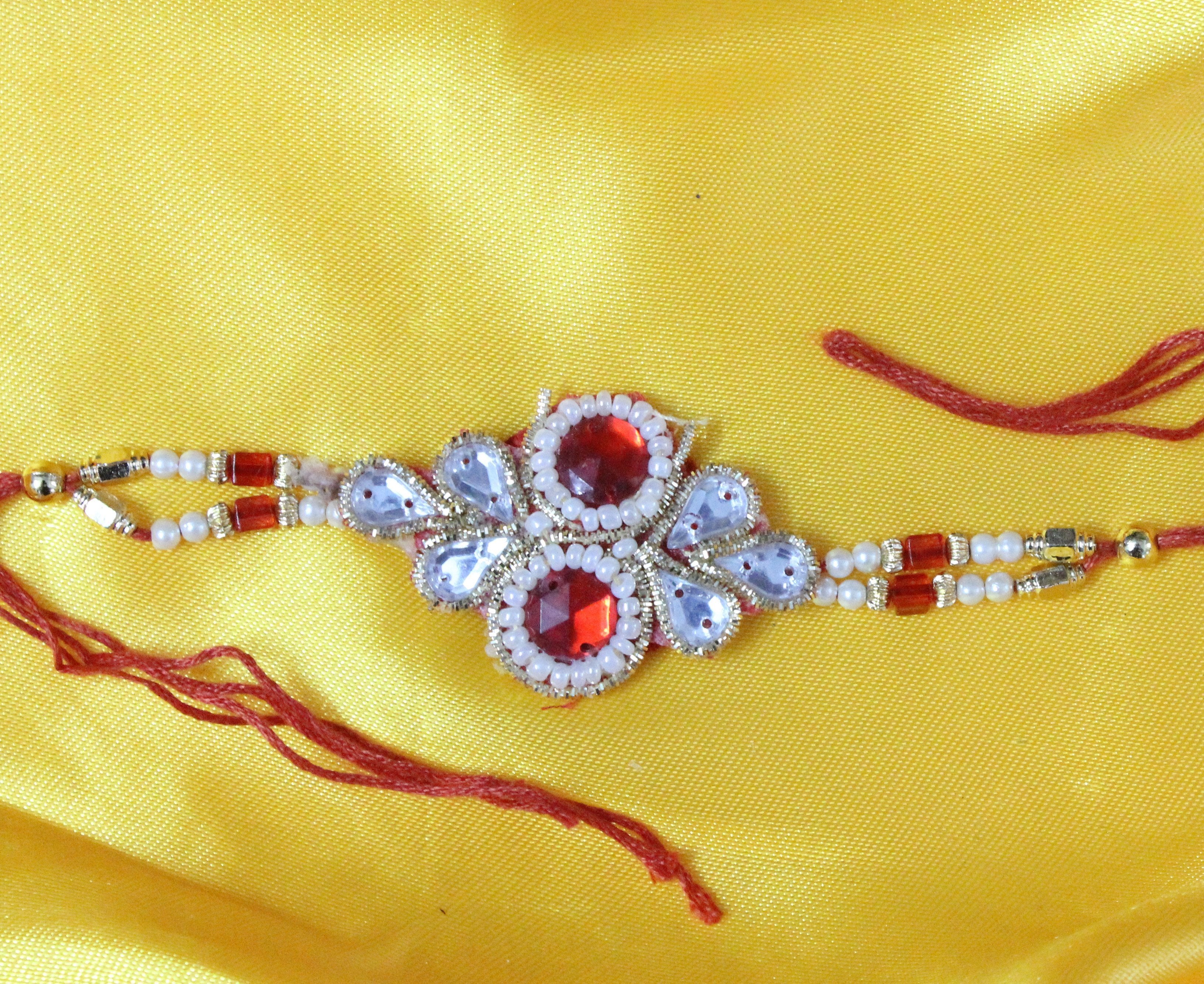 Orange and White Bead Rakhi - ApkaMart